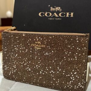 BNIB COACH GOLD WRISTLET WITH SILVER STARS
